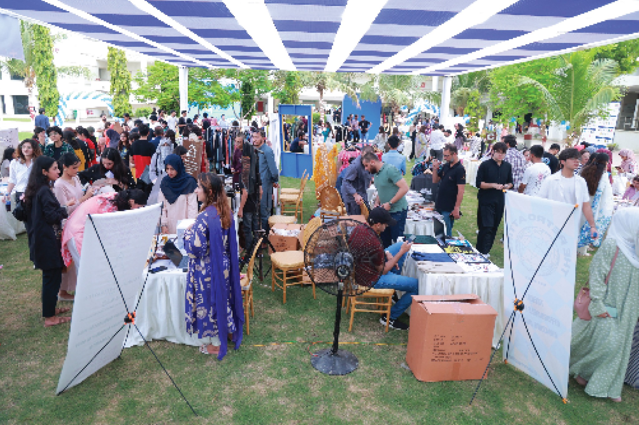 Visitors exploring stalls at a previous I-Bazaar festival